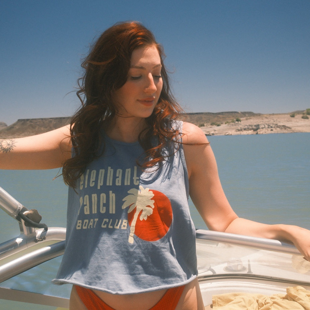 Elephant Ranch Boat Club Tank worn on a boat, square lifestyle product photo