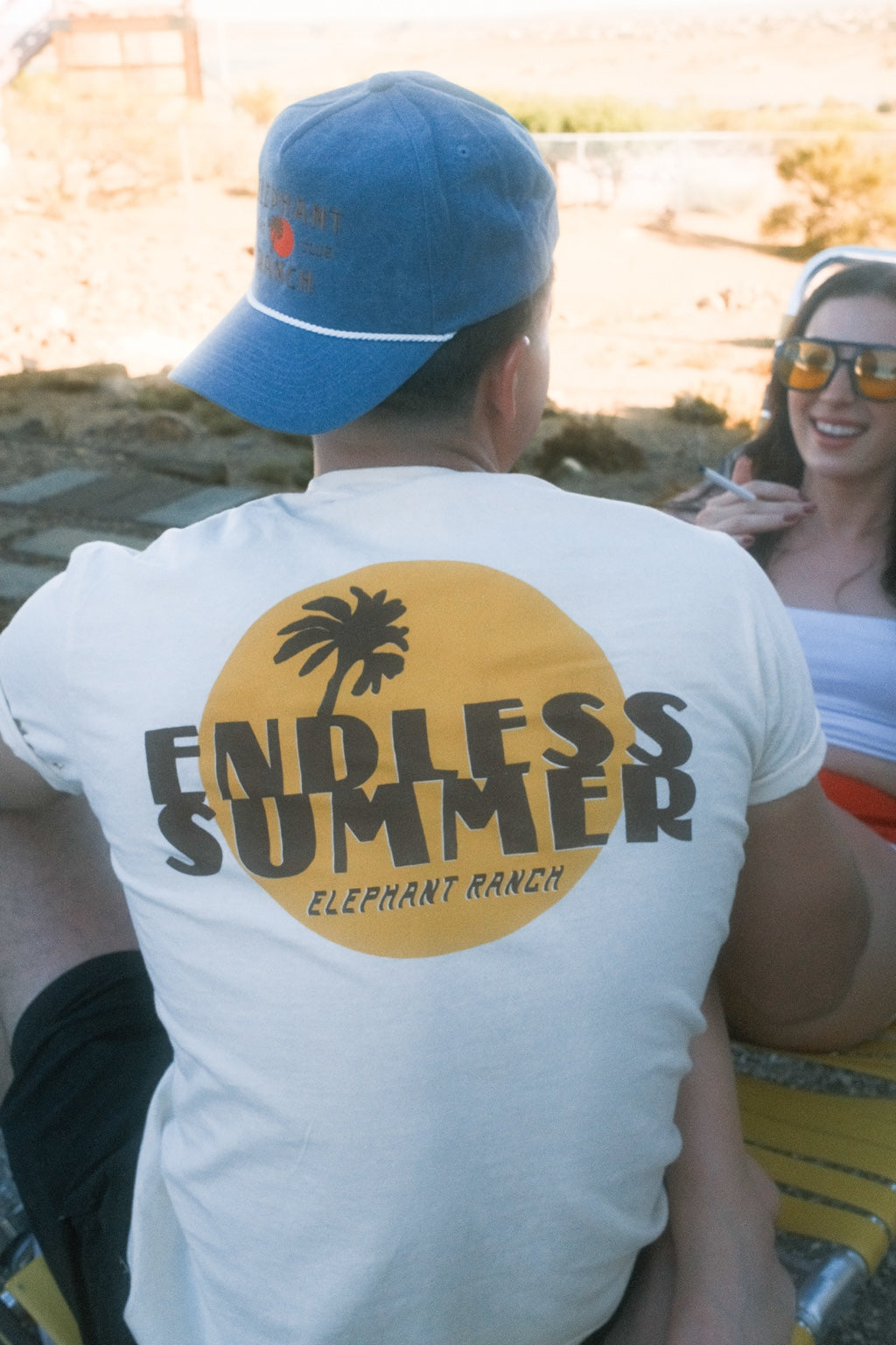 Back of Endless Summer Yellow graphic Elephant Ranch T-shirt